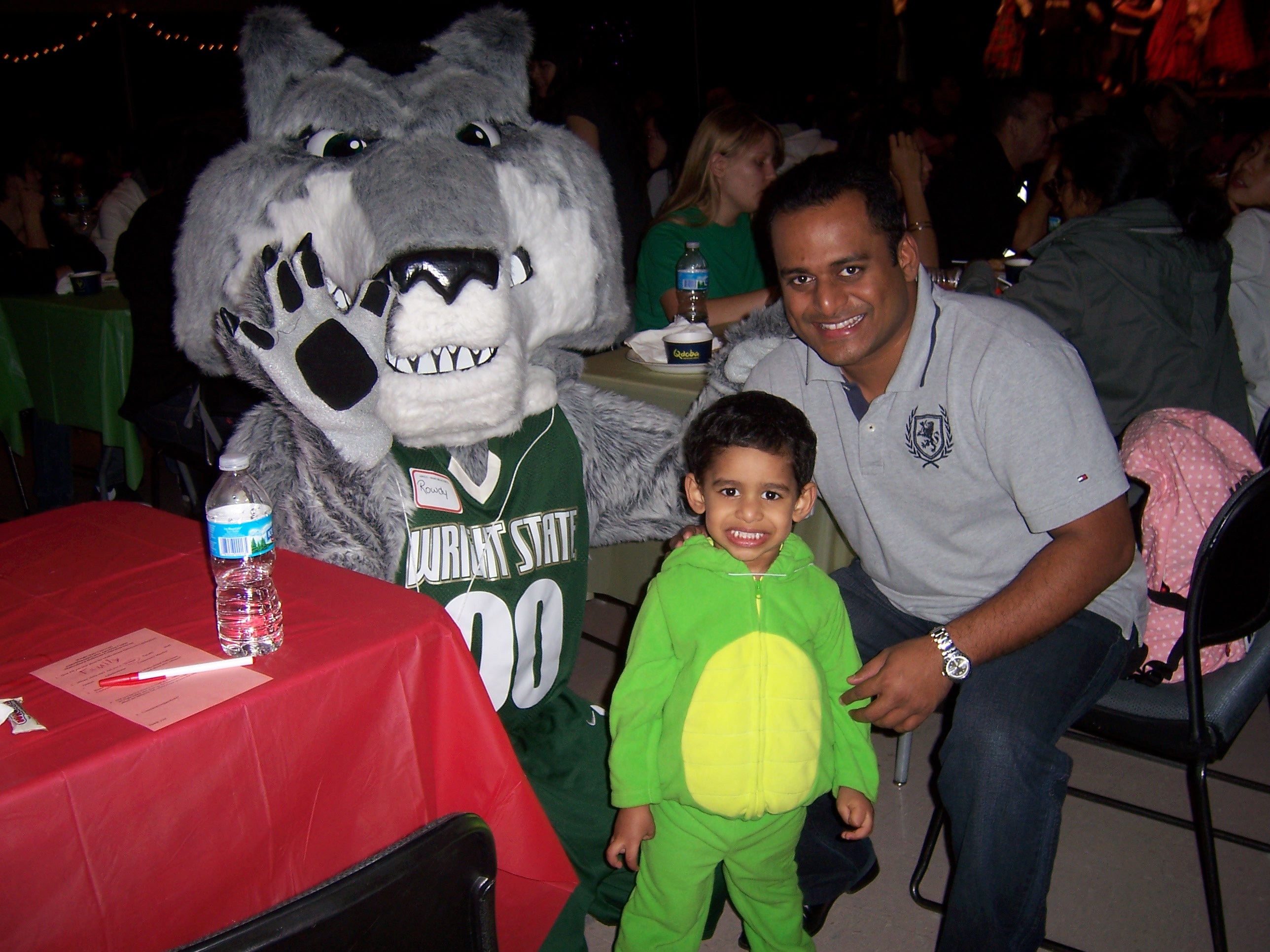 Photo of Renjith George Mathew, his son Johnny and Rowdy Raider at Multicultural Halloween.