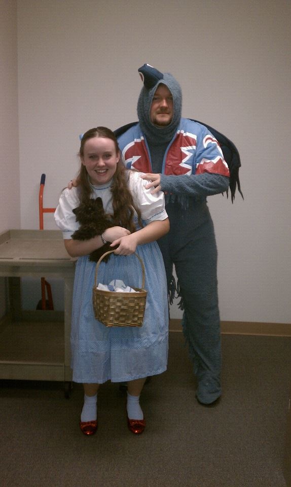 Photo of two employees from the Registrars office dressed for Halloween at the office.