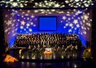 Photo of the orchestra and choir onstage at the Schuster Center.