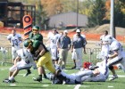 Photo of Wright State football player Trevor Luckenbill dragging defenders.