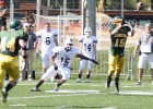 Photo of defensive back Davey Jordan intercepting a pass during the homecoming football game against Xavier University.
