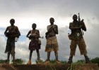 Photo of four child soldiers in Uganda.