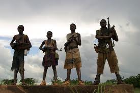 Photo of four child soldiers in Uganda.