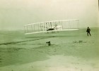 The iconic image of the first powered flight with Orville Wright at the controls and Wilbur by the wing