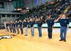 Photo of 12 students taking the oath to join the Air Force at halftime of the Wright State vs. Cleveland State basketball game.