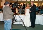 Photo of Ran and Mary Raider being interviewed at their wedding.