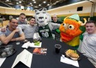 Photo of former and current Wright State students with the current Rowdy Raider and the old Rowdy Raider that was a viking.