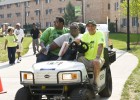 Photo of former Wright Stste employee Mike Schulze helping parents and students move on to campus during Move-in Day.