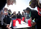 Photo of students playing flip-cup.