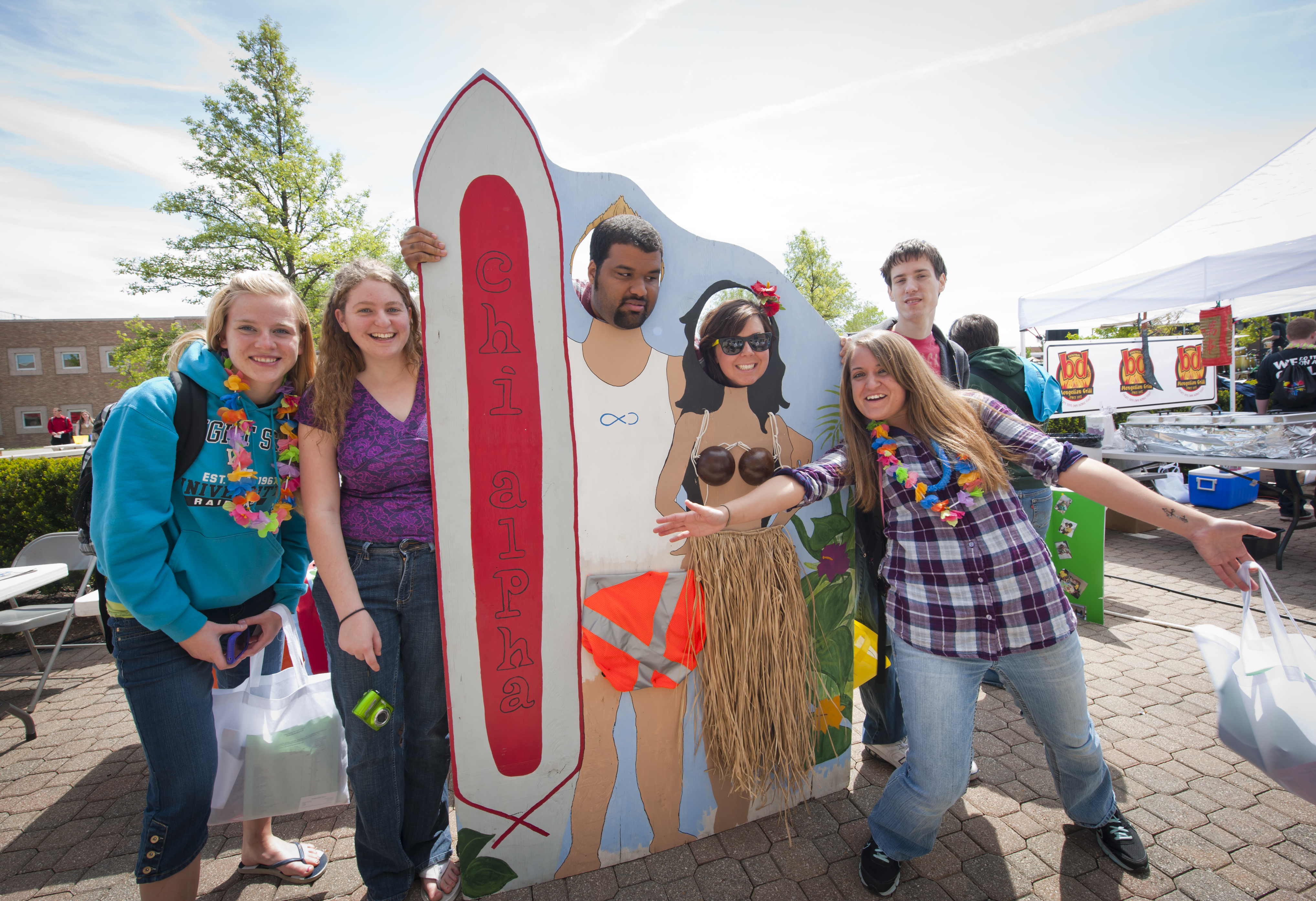 Photo of students posing with beach cutouts.