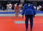 Photo of two people preparing to fight in a judo tournament.