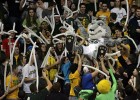 Photo of Rowdr Raider crowd surfing among basketball fans at a Raiders basketball game at the Wright State Nutter Center.