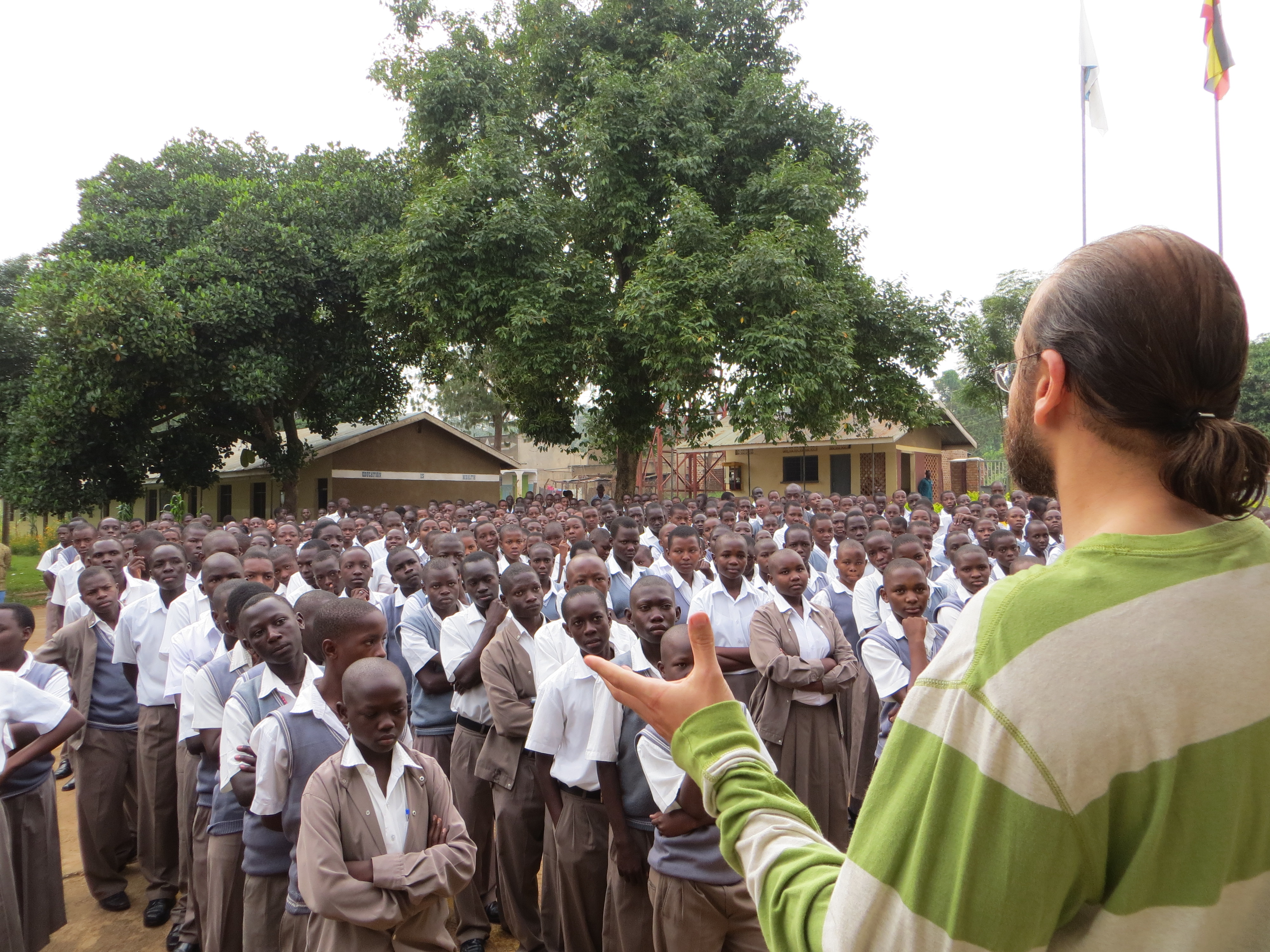 Photo of Engineering professor Nasser Kashou addressing students in Uganda