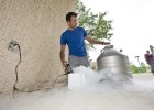 Photo of Wright State student Jason Baldwin and his liquid nitrogen ice cream maker