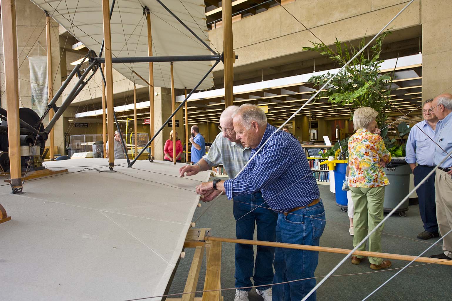 Jerry Beech and Jay Phipps inspect the biplane