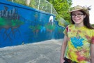 Megan Smallwood with the mural