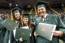 Graduates with diplomas