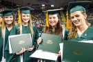 Graduates with diplomas