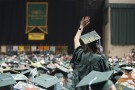 Graduate waves from the arena floor