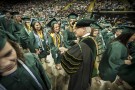 President David R. Hopkins congratulating graduates.