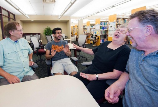 Retirees and a student talking