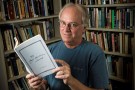 James Guthrie holding the Emily Dickinson Journal