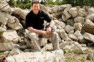 Jim Gruenberg sitting on rocks at Calamityville