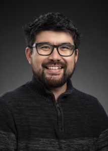 A man posing for a professional portrait.